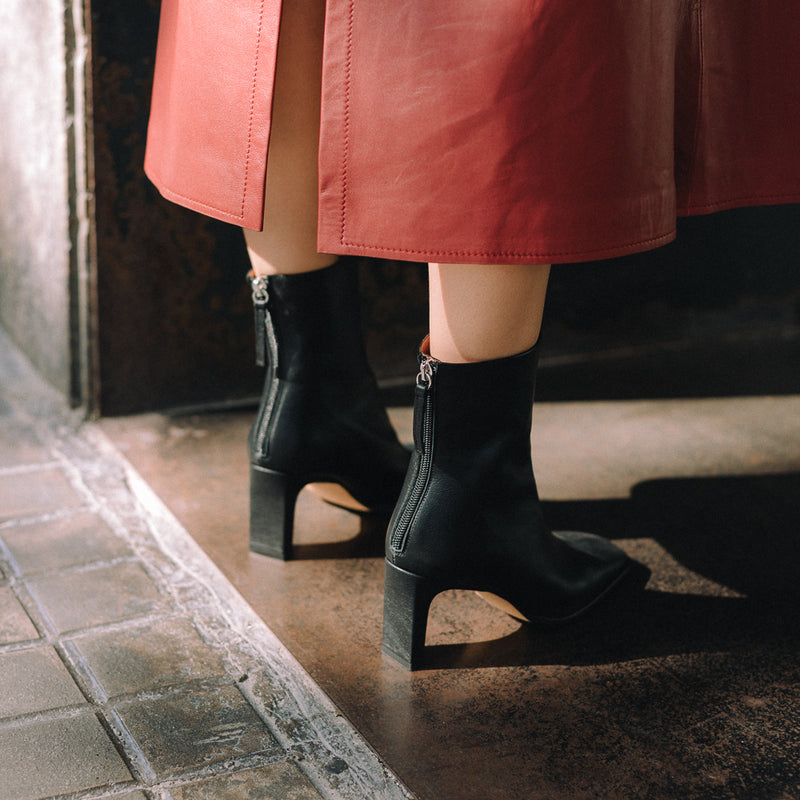 Black ankle boot with comfortable heel, comfortable closet background, combines with everything.