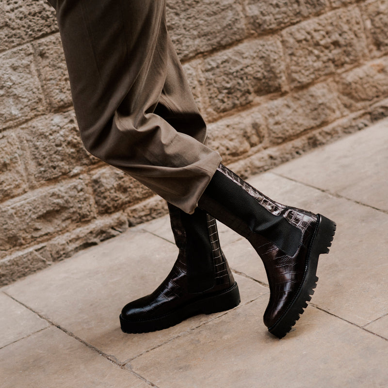 Biker boot with lightweight, weightless track sole in black coconut-effect leather with elasticated sides.
