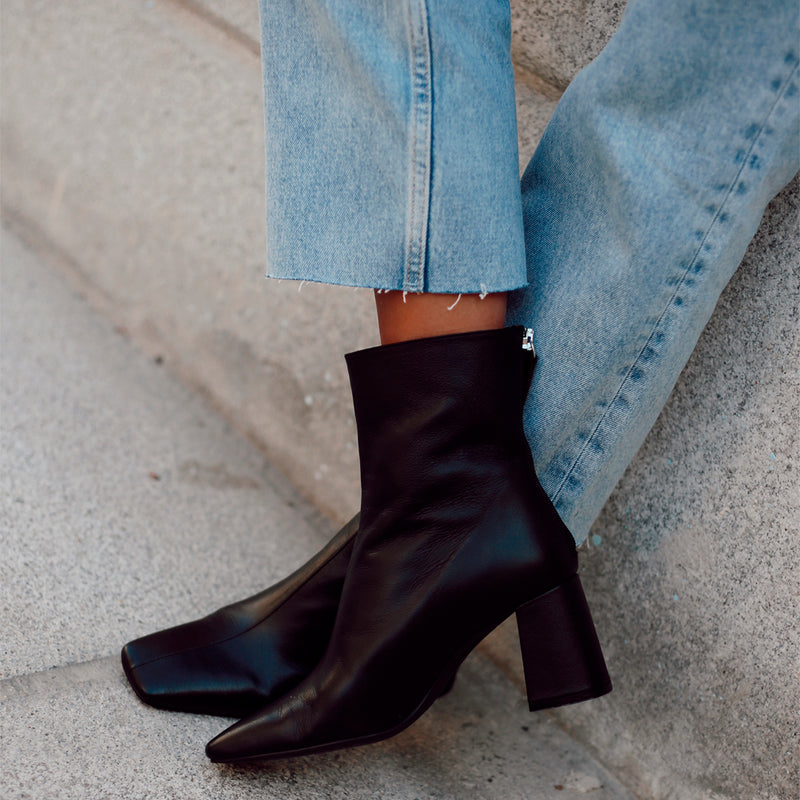 Black heeled ankle boot, a closet essential that goes with everything.