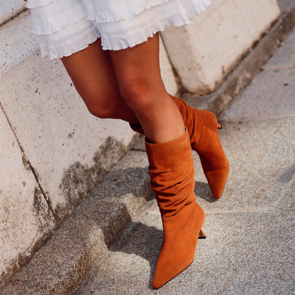 Women's midi heel ankle boots made in brown suede.