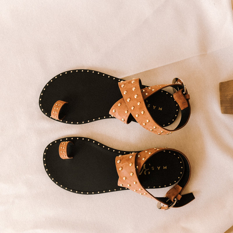 Cognac suede sandals with crossed straps and golden studs
