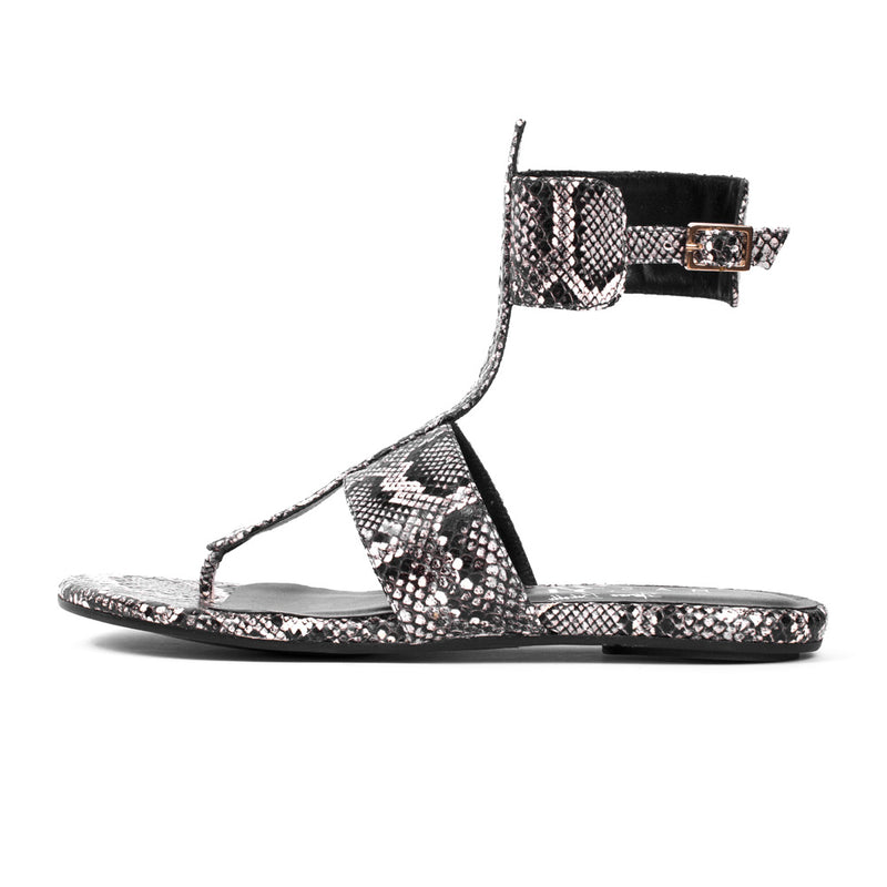 Woman's flat sandal that lengthens the legs in python snake print natural colour