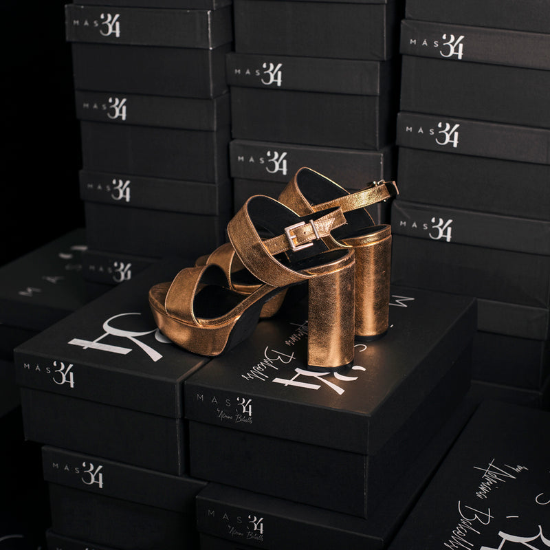 Heel and platform sandal for day and evening events in gold leather