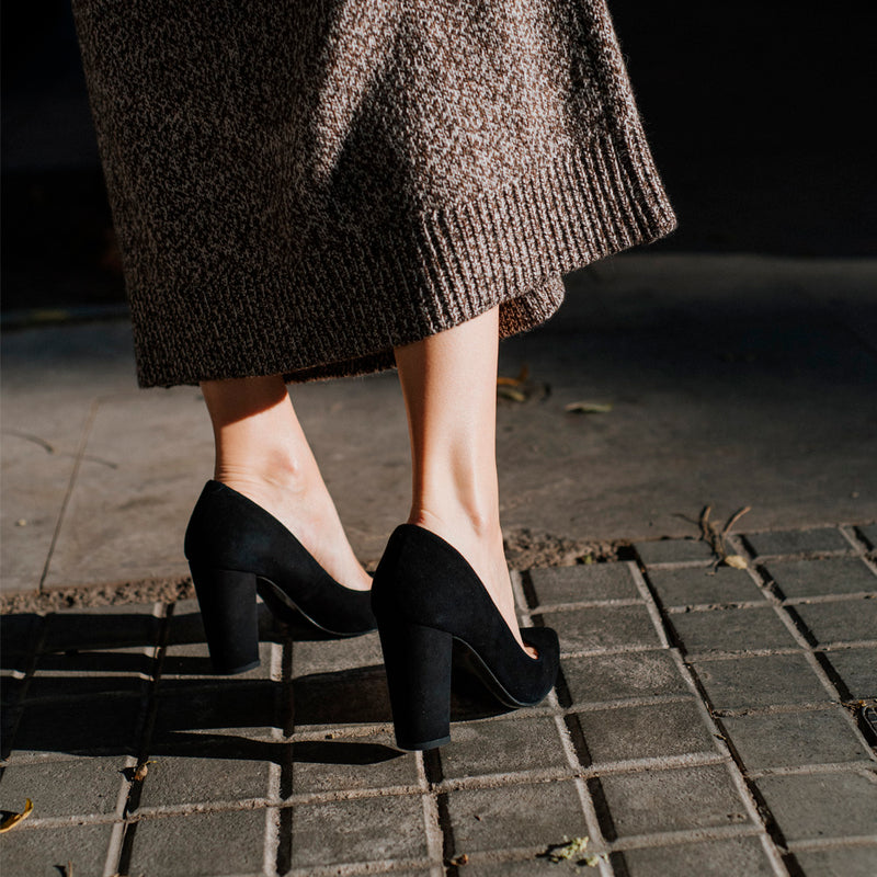 Comfortable black suede heels for the office.