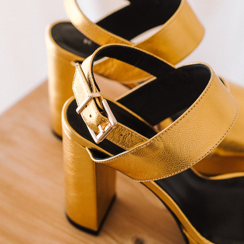 Wide heeled sandals with a very comfortable platform perfect for all day wear in gold leather